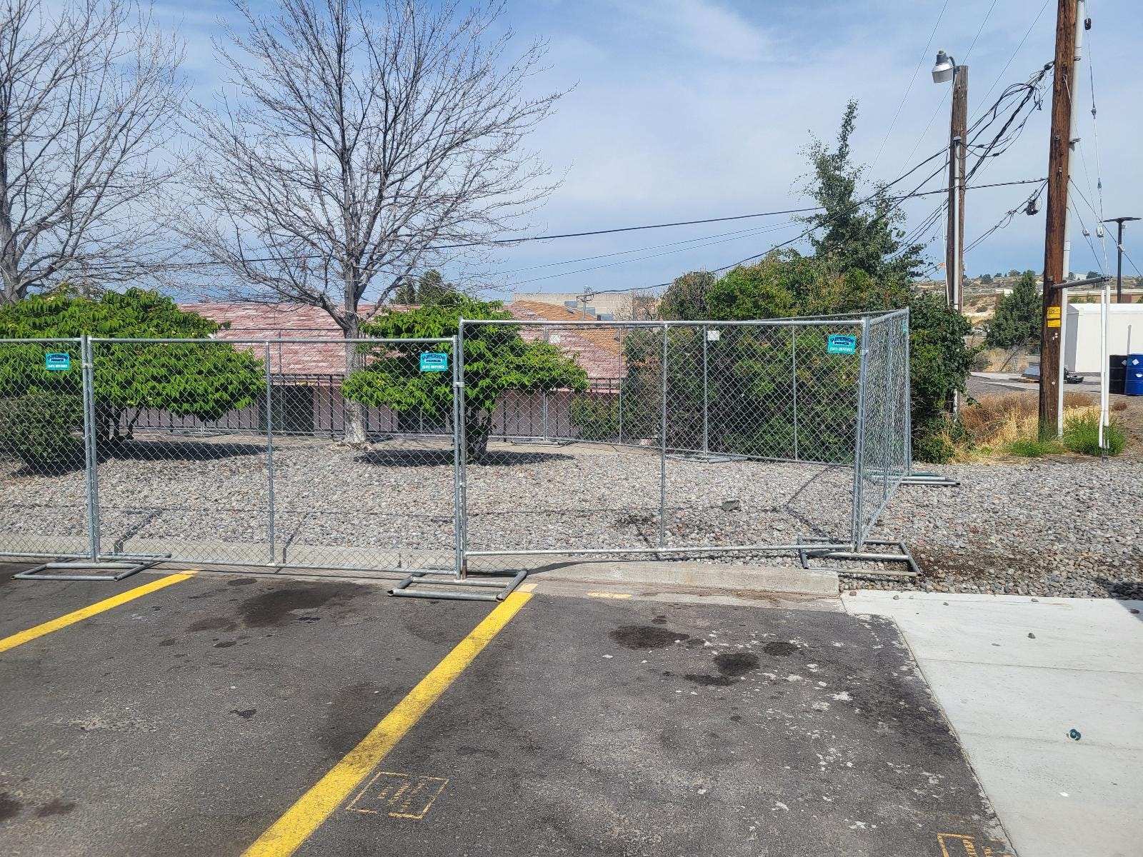 Temporary chain link fencing panels on a construction site