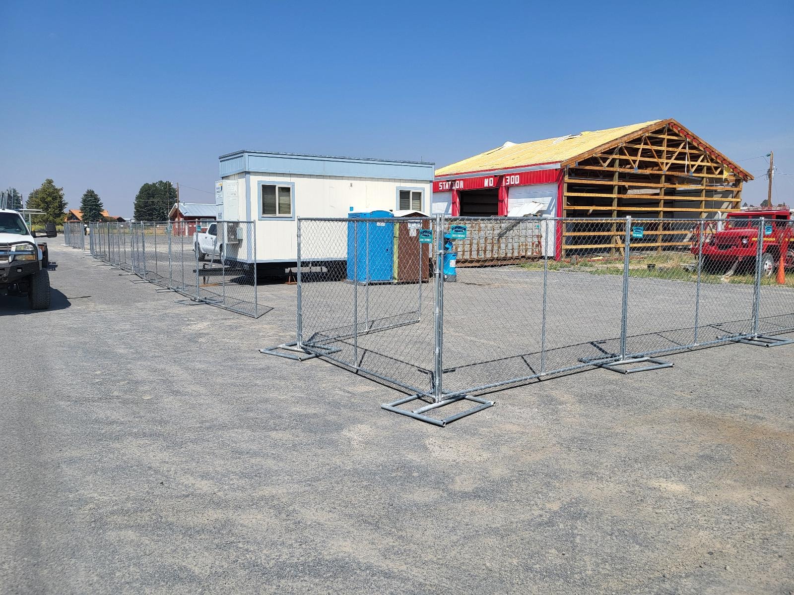 Temporary fencing enclosing a fire station construction site